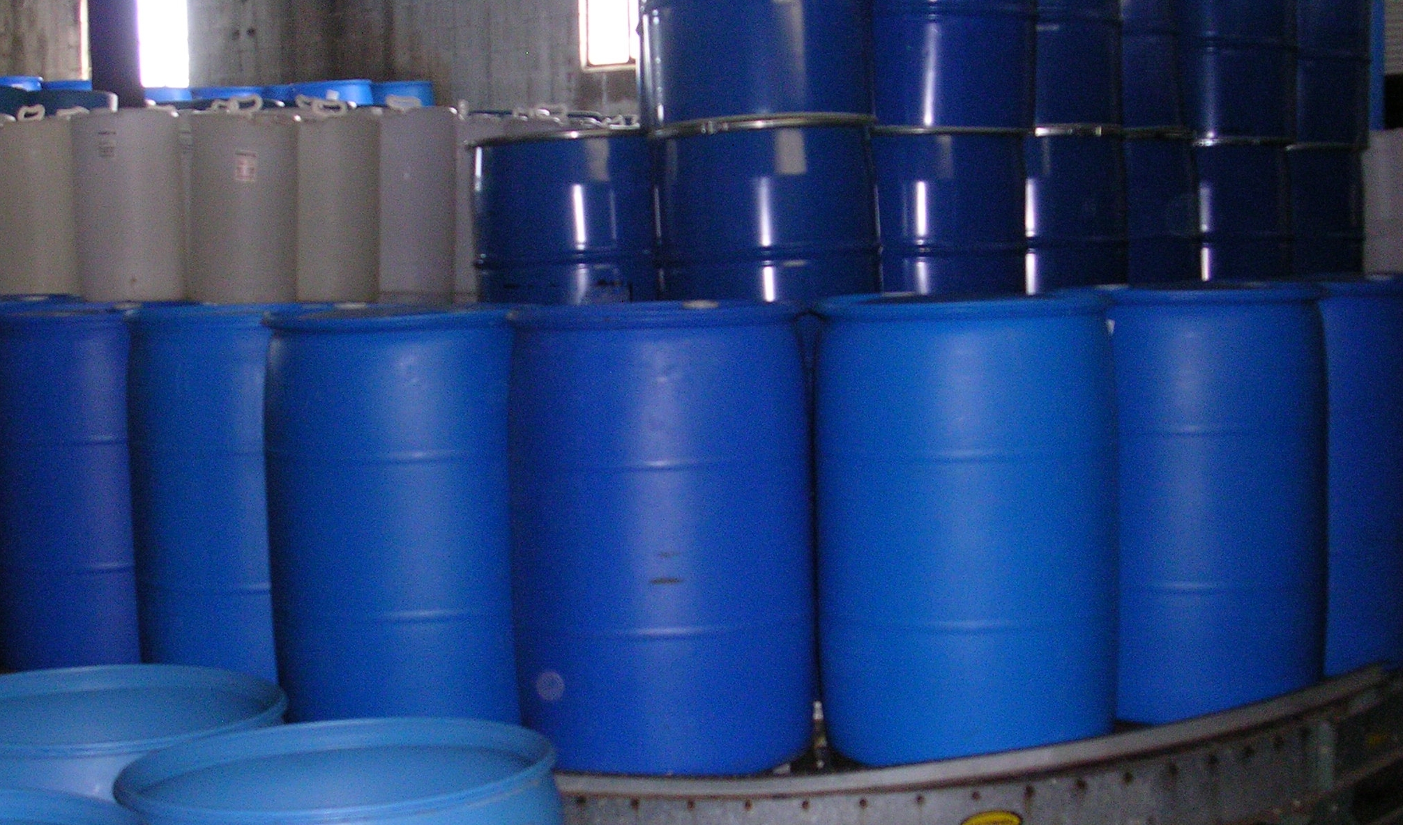 blue industrial drums on conveyor